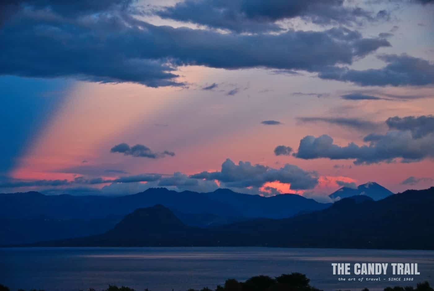 awesome sunset over volcanoes at Lake Atitlan in Guatemala