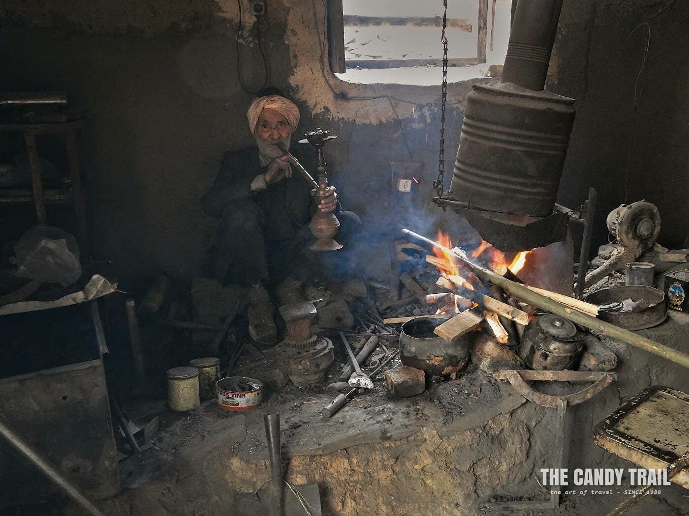 blacksmith smoking water pipe kang village iran